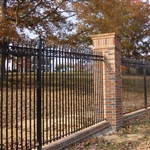 Iron railings and stone or brick